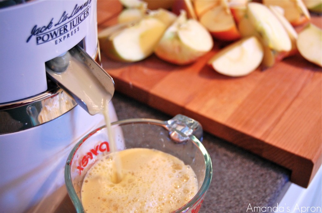 Juicing apples for homemade apple cider from Amanda's Apron